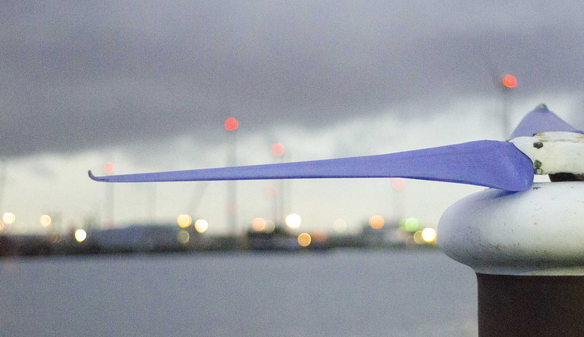 pet windturbine propeller with harbour in background